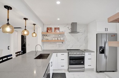 Completely renovated and move-in ready! This stunning unit has - photo 17