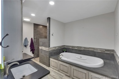 This 3-bedroom, 2-bath home on Nonsuch in Lake Ozark is now - photo 19
