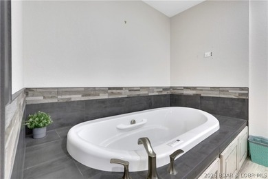 This 3-bedroom, 2-bath home on Nonsuch in Lake Ozark is now - photo 21
