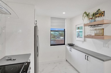Completely renovated and move-in ready! This stunning unit has - photo 22