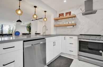 Completely renovated and move-in ready! This stunning unit has - photo 24