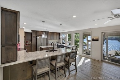 This 3-bedroom, 2-bath home on Nonsuch in Lake Ozark is now - photo 28