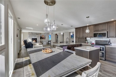 This 3-bedroom, 2-bath home on Nonsuch in Lake Ozark is now - photo 31