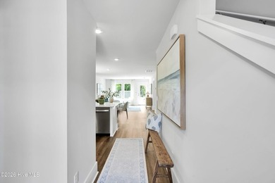 The Norman townhome is a two-story residence with 4 bedrooms and - photo 3