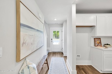 The Norman townhome is a two-story residence with 4 bedrooms and - photo 4