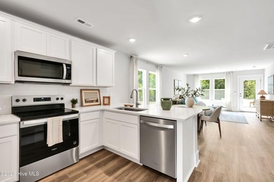 The Norman townhome is a two-story residence with 4 bedrooms and - photo 6