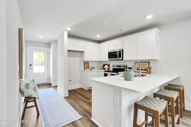 The Norman townhome is a two-story residence with 4 bedrooms and - photo 9