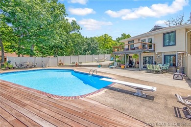 Nestled on over 2 acres with panoramic views of Lake of the - photo 12