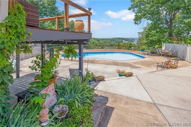 Nestled on over 2 acres with panoramic views of Lake of the - photo 17
