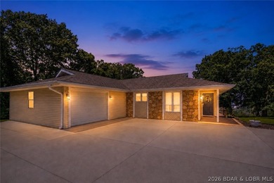 Nestled on over 2 acres with panoramic views of Lake of the - photo 19