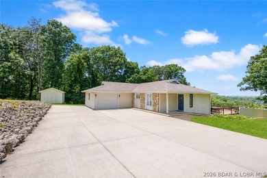 Nestled on over 2 acres with panoramic views of Lake of the - photo 21