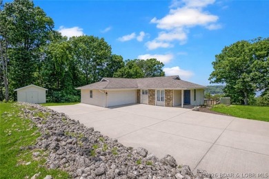 Nestled on over 2 acres with panoramic views of Lake of the - photo 22