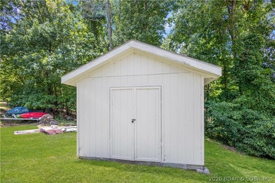 Nestled on over 2 acres with panoramic views of Lake of the - photo 23