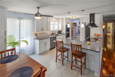 Nestled on over 2 acres with panoramic views of Lake of the - photo 24