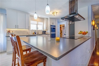 Nestled on over 2 acres with panoramic views of Lake of the - photo 25