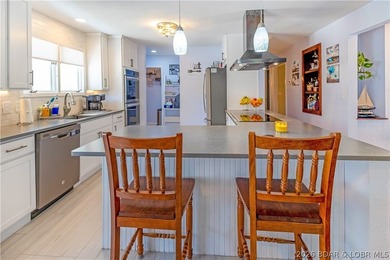 Nestled on over 2 acres with panoramic views of Lake of the - photo 27