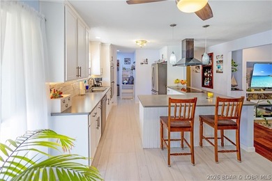 Nestled on over 2 acres with panoramic views of Lake of the - photo 28