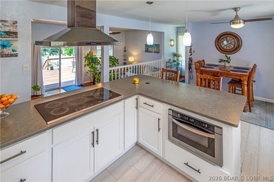 Nestled on over 2 acres with panoramic views of Lake of the - photo 30
