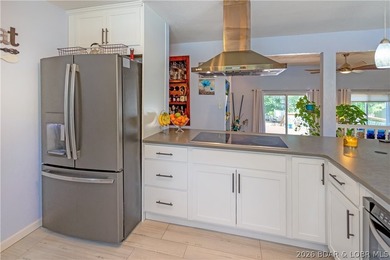 Nestled on over 2 acres with panoramic views of Lake of the - photo 32