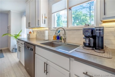Nestled on over 2 acres with panoramic views of Lake of the - photo 33