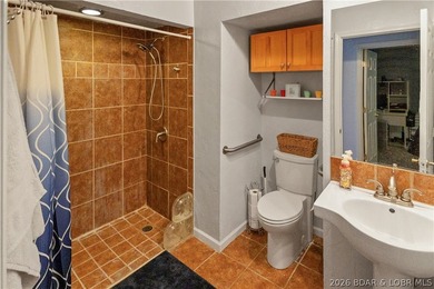 Nestled on over 2 acres with panoramic views of Lake of the - photo 45