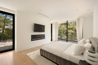 Set amidst lush greenery in one of the Hamptons' most serene - photo 12