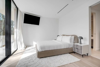Set amidst lush greenery in one of the Hamptons' most serene - photo 17