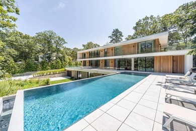 Set amidst lush greenery in one of the Hamptons' most serene - photo 26