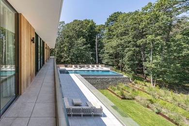 Set amidst lush greenery in one of the Hamptons' most serene - photo 28