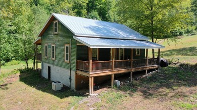 Welcome to an extraordinary 100+ acre mountain homestead nestled - photo 2