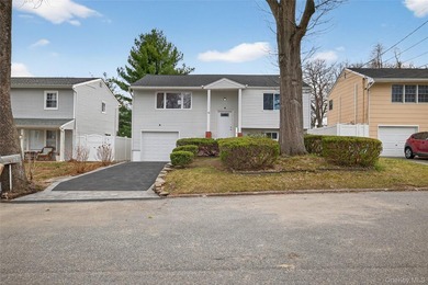 Beautifully renovated 4-bedroom Hi-Ranch offering exceptional - photo 1