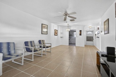 Welcome home to this inviting residence featuring tile floors & - photo 12