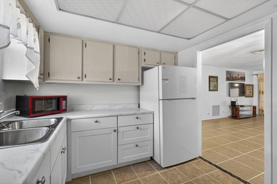 Welcome home to this inviting residence featuring tile floors & - photo 17