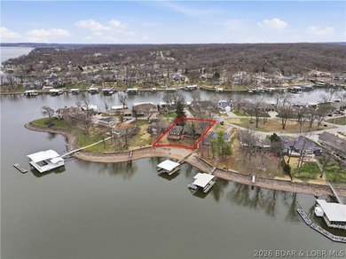 Rare opportunity to own a flat, step-free lakefront lot in the - photo 3