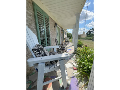 Nestled on the outskirts of Fairhope, this appealing