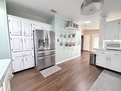 Experience elevated, low-maintenance living in this beautifully - photo 9