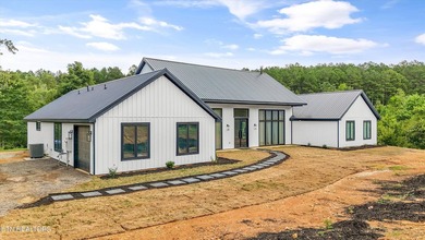 Set on 5.59 acres, this new custom ranch offers a beautiful - photo 50