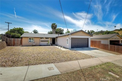 This charming 3-bedroom, 2-bathroom home, perfectly situated on - photo 2