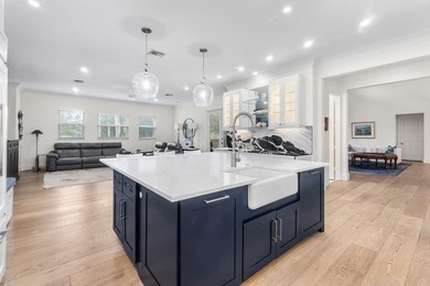 Situated on nearly 2 acres in the gated golf and equestrian - photo 14