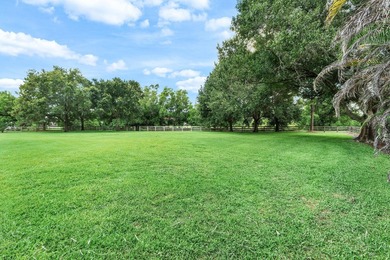 Situated on nearly 2 acres in the gated golf and equestrian - photo 34