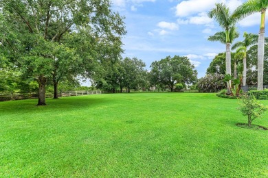 Situated on nearly 2 acres in the gated golf and equestrian - photo 35