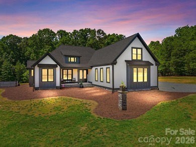 2023 build, sitting on 4.77 acres this 4BR, 3.5BA home blends - photo 1