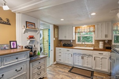 Welcome to your lake retreat! This darling cabin is in a quiet - photo 14