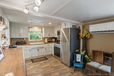 Welcome to your lake retreat! This darling cabin is in a quiet - photo 15