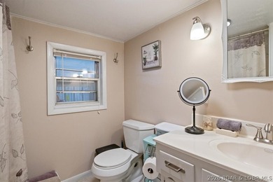 Welcome to your lake retreat! This darling cabin is in a quiet - photo 18