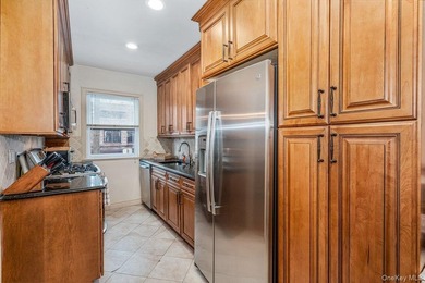 Updated one-family attached brick townhouse nestled in the heart - photo 7