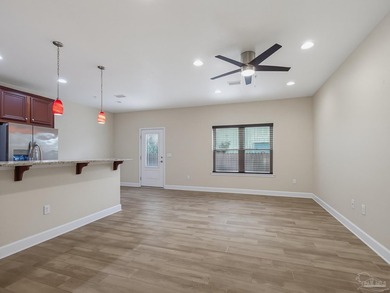 Located in the gated community of Mossy Oak Villas, this - photo 3