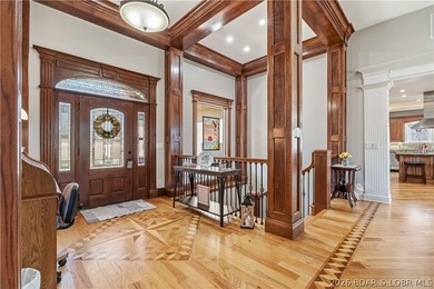 Set on the private waters of Treeline Lake in Four Seasons, this - photo 4