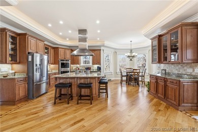 Set on the private waters of Treeline Lake in Four Seasons, this - photo 9