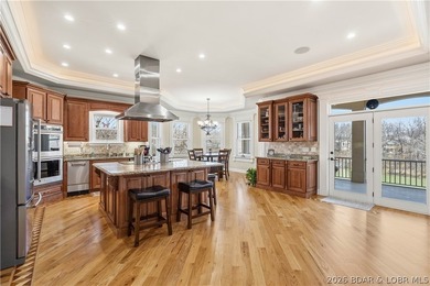 Set on the private waters of Treeline Lake in Four Seasons, this - photo 10